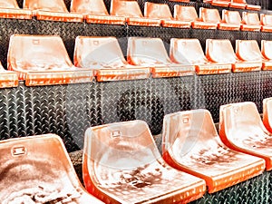 Old weathered rusty chairs on outdoor seating