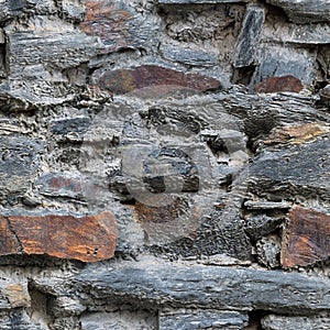 Old weathered stone wall seamless tileable texture