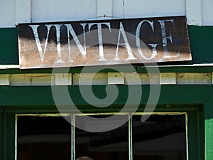 Old Weathered Vintage Sign Hanging Over Window