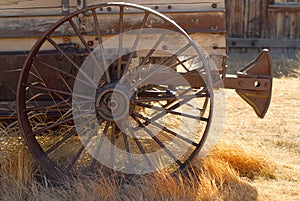 Old weathered wagon with rusted wheel