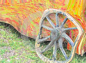 Old weathered wagon wheel with wooden spokes leaning against a y