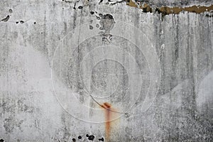 old weathered wall with chipped paint and rust stains abstract background texture