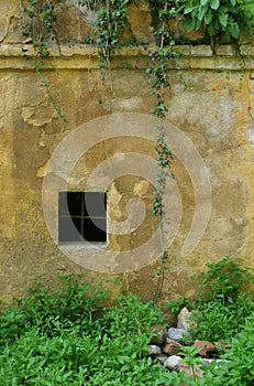 Old weathered wall with window