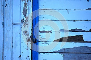 Old weathered white and blue door