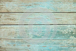 Old weathered wood plank painted in blue