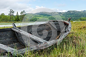 Old and weathered wooden boat wreck