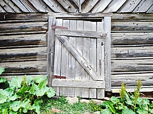 Old weathered wooden farm barn door