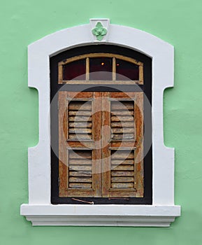 Old and weathered wooden heritage window at Penang, Malaysia