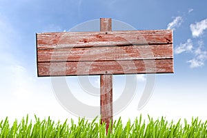 Old weathered wooden sign on nature