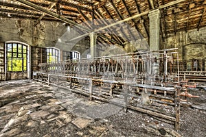 Old weaving looms and spinning machinery at an abandoned factory photo