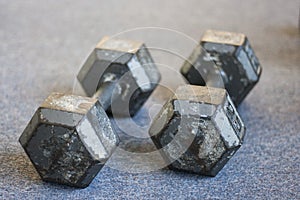Old weights on carpet floor