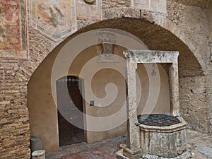 Old well as an architectural detail from the streets of San Gimignano in Tuscany