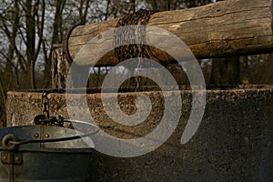 Old well, bucket and string.