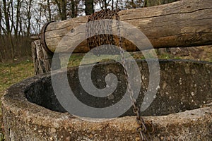 Old well, bucket and string.