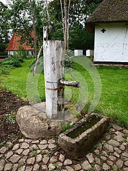 Old well water pump in a farm