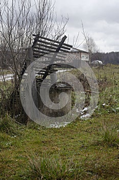 Old well with wooden roof. Old abandoned well with wooden roof