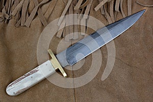 Old west bowie knife on leather jacket