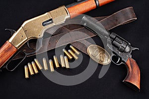 Old west rifle with revolver and ammunition