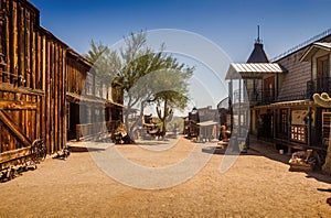 Old Western Goldfield Ghost Town square with huge cactus and saloon, photo taken during the sunny day