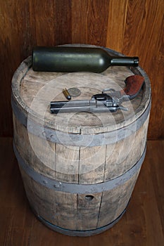 Old western revolver with cartridges and silver dollar