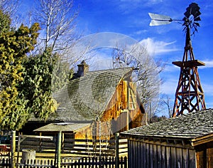 Old Western wooden Barn and Windmill