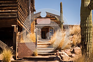 Old Western Wooden Buildings in Goldfield Gold Mine Ghost Town in Youngsberg, Arizona, USA