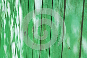 Old wethered green wooden fence background texture, Perspective
