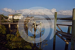 Old wharves and buildings on river at Mackay photo