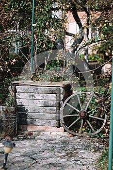 An old wheel and an abandoned well in the village