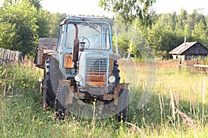 Old wheel tractor with the trailer