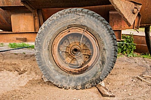 The old wheel of the trailer