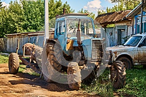 Old wheeled tractor with trailer