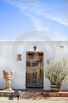 Old white adobe building photo