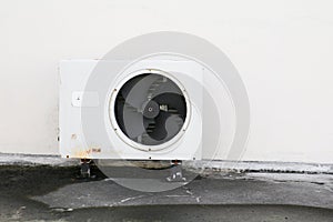 Old white air conditioner compressor. rust metal on floor