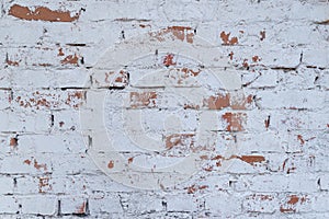 Old white brick wall with stained aged bricks. Urban background, white ruined industrial brick wall texture.