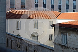 Old white building with red clay roof tiles in Slovakia