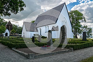 Old white church in Sweden descending from the middle ages