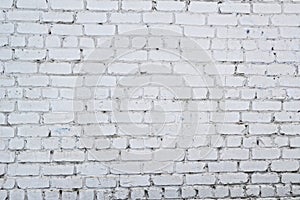 Old white concrete wall with cracks