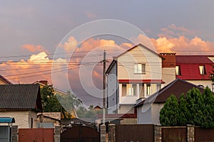 Old white cottage in cozy town. Street view landscape old cirty, little houses on sunset. Old architecture front view