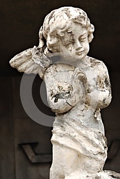 An Old White Crumbling Cherub Angel Statue