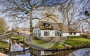 Old white farm in historical village Giethoorn