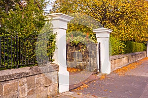 Old, white gate at the old house in Autumn