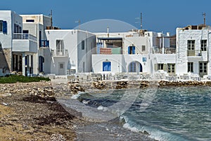 Old white house and Bay in Naoussa town, Paros island, Greece