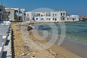 Old white house and Bay in Naoussa town, Paros island, Greece