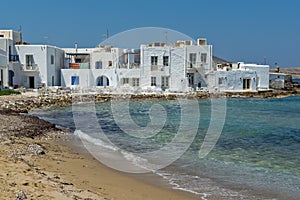 Old white house and Bay in Naoussa town, Paros island, Greece