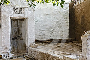 Old white house with a grey door and Ganesha sculpture, Jaisalmer fortress, Rajasthan, India