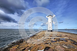 An old white lighthouse in Swinoujscie, Poland. photo