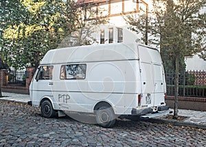 Old white rusty scrap German commercial panel van VW LT 28 parked