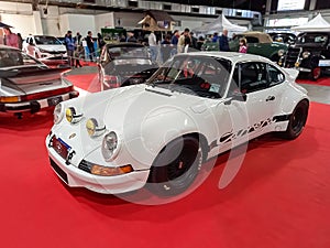 Old white sport 1973 Porsche 911 RSR Carrera speedster coupe on the red carpet. Classic car show