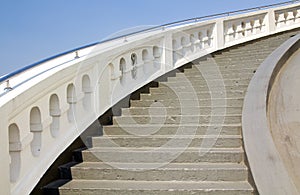 Old white stone circular stairs case